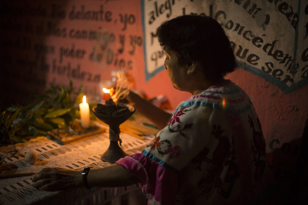 A curandera performs a cleansing ritual