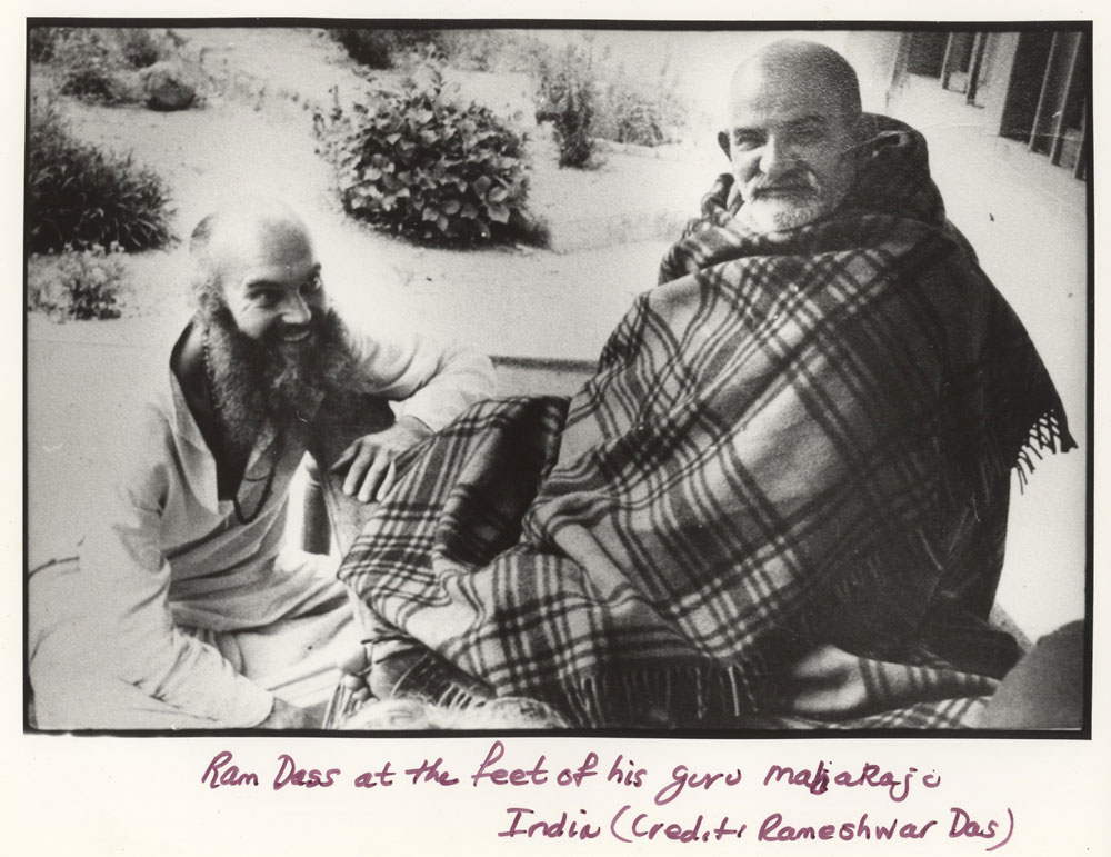 black and white photo of ram dass and his guru neem karoli baba